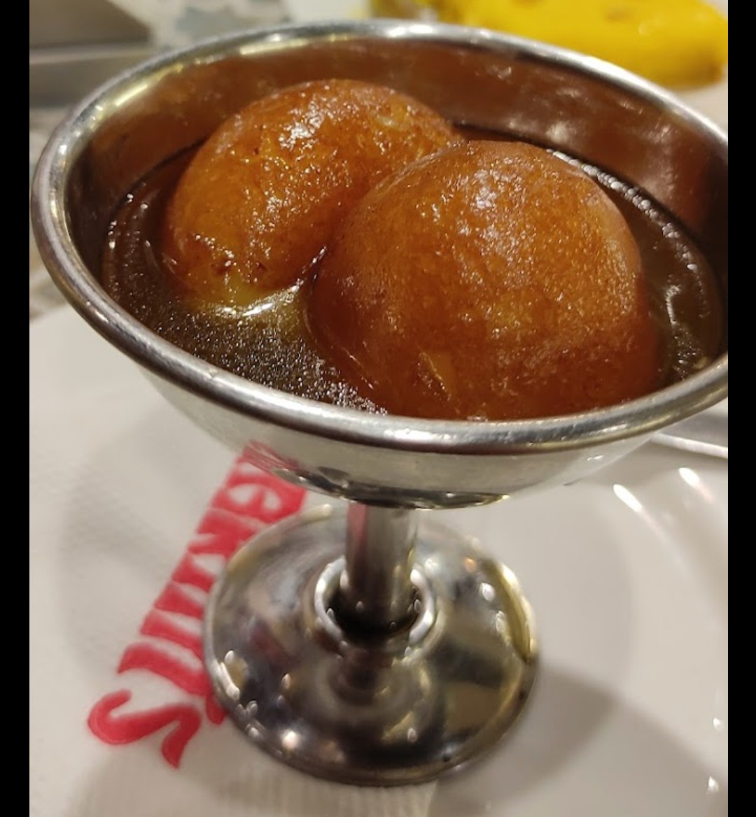 Warm gulab jamun soaked in sugar syrup at Karim's, Nibra, Howrah